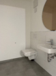 Gäste-WC - modernes Wohnen auf einer Ebene: stilvolle 3-Zimmer-Wohnung mit Terrasse und TG-Stellplatz